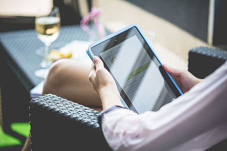 Girl using Tablet on the Garden thumbnail