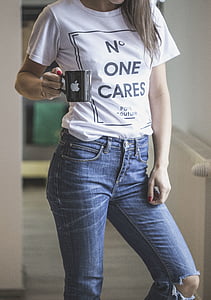 woman wearing white top and holding mug thumbnail