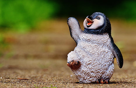 gray and black penguin figurine thumbnail