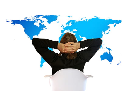 person sitting on chair facing map thumbnail