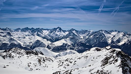 snowy mountains under blue sky at daytime thumbnail