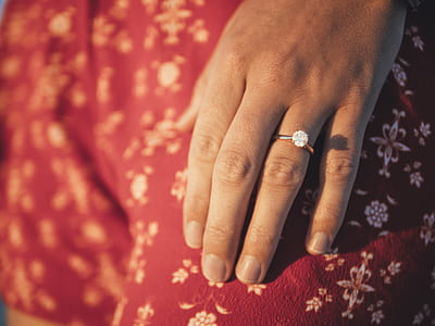 person wearing silver-colored clear gemstone encrusted ring thumbnail