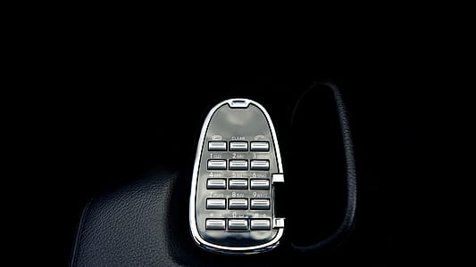 Gray Remote Control on Black Holder thumbnail
