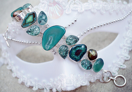silver-colored jewelry with teal gemstones thumbnail