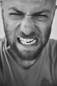 man showing his teeth thumbnail