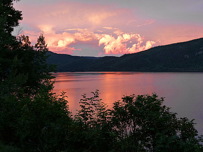 mountain near body of water during daytime thumbnail