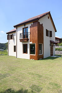 2-storey house on green grass thumbnail