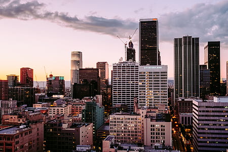 city skyline of buildings under white and blue ksy thumbnail