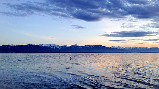 landscape photography of mountain near body of water thumbnail
