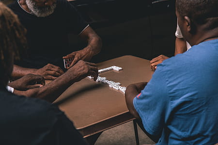 Four People Playing Domino thumbnail