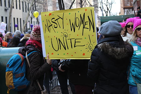 group of people gather on street attending rally thumbnail