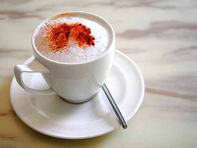 filled teacup on saucer thumbnail