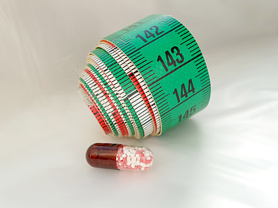 green and black tape measure thumbnail