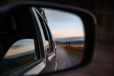 closeup photography of vehicle side mirror thumbnail