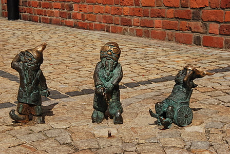 three green animal-themed figurines at outdoors thumbnail