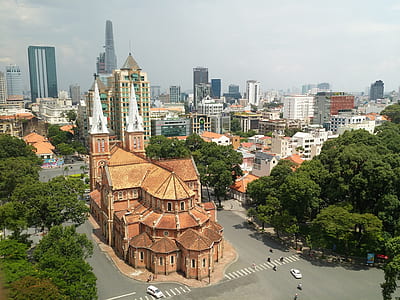 high-angle photography of brown house between roads thumbnail