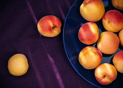 yellow-and-red apple fruits on plate thumbnail