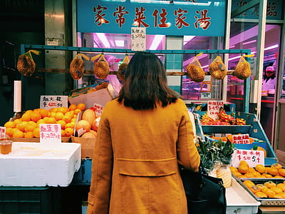 woman standing infront of fruit stand thumbnail