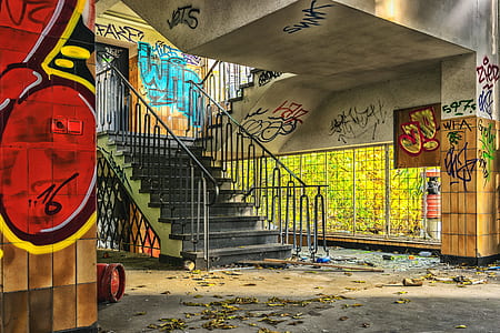 black concrete stairs near wall with graffiti thumbnail