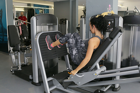 woman using leg press exercise equipment thumbnail