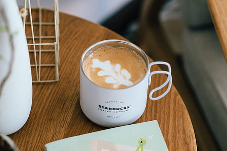 white Starbucks mug filled with latte thumbnail