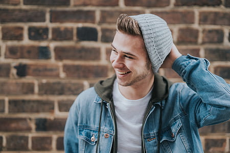 man smiling white holding head thumbnail
