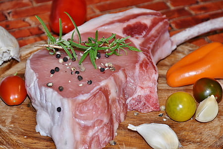 sliced raw meat and black pepper on top thumbnail