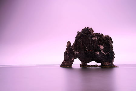 rock formation on body of water thumbnail
