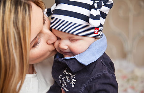 woman kissing baby on cheek thumbnail