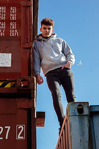 man standing on trailer thumbnail