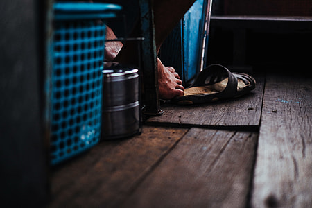 black slide sandal on floor thumbnail