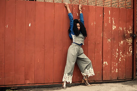 Woman in Gray and Blue Long-sleeved Shirt and Gray Pants thumbnail