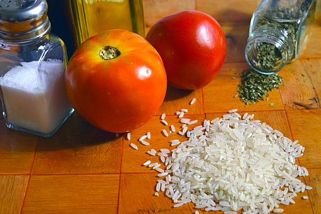 two ripe tomatoes near rice and salt thumbnail