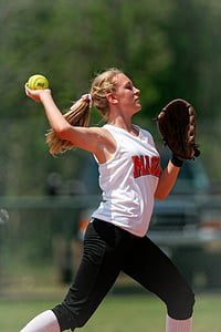selective focus photography of woman throwing softball thumbnail