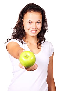 woman wearing white v-neck t-shirt holding green apple thumbnail