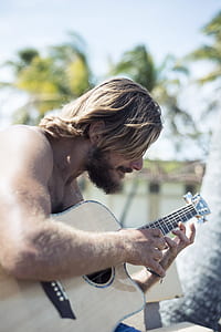 man holding guitar thumbnail