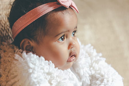 Cute Baby Girl With Pink Bow Headband Photo thumbnail