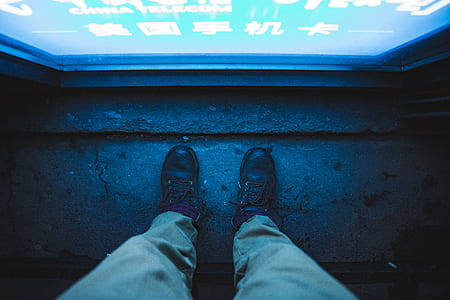 man standing in front of signage thumbnail