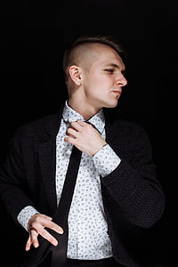 man fixing his necktie thumbnail