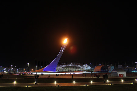 people walking near building during nighttime thumbnail