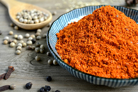 orange powder on black and gray ceramic bowl thumbnail