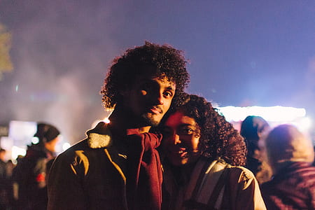 man beside woman smiling on camera thumbnail