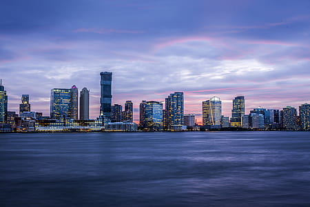 city scapes near sea at daytime thumbnail