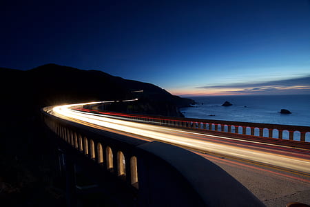 timelapse photography of bridge near body of water thumbnail
