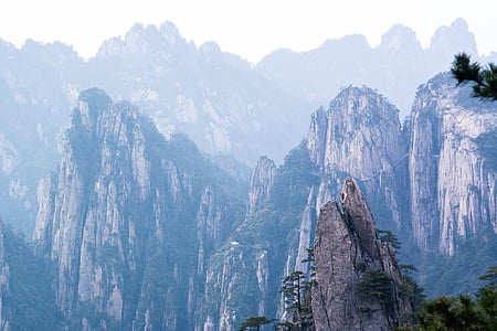 mountain under cloudy sky at daytime thumbnail