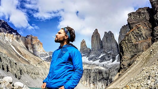 man standing under mountain thumbnail