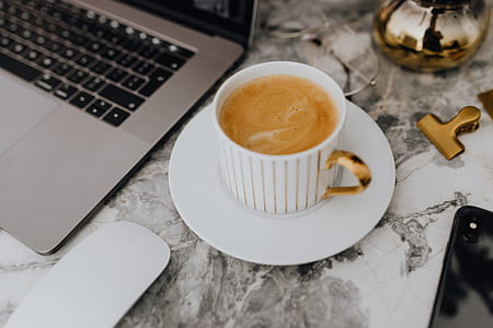 Coffee in a cup on a marble desk thumbnail