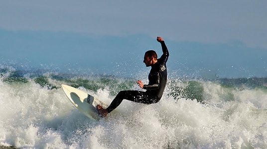 man surfing on body of water thumbnail