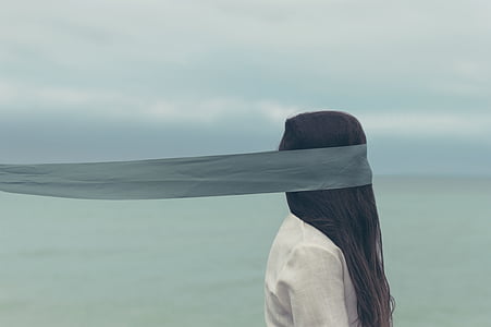 woman standing near the shore thumbnail