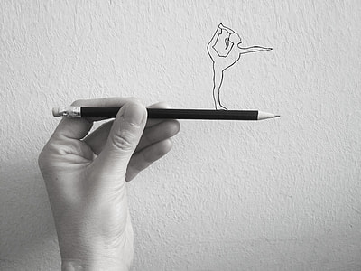 person holding pencil thumbnail